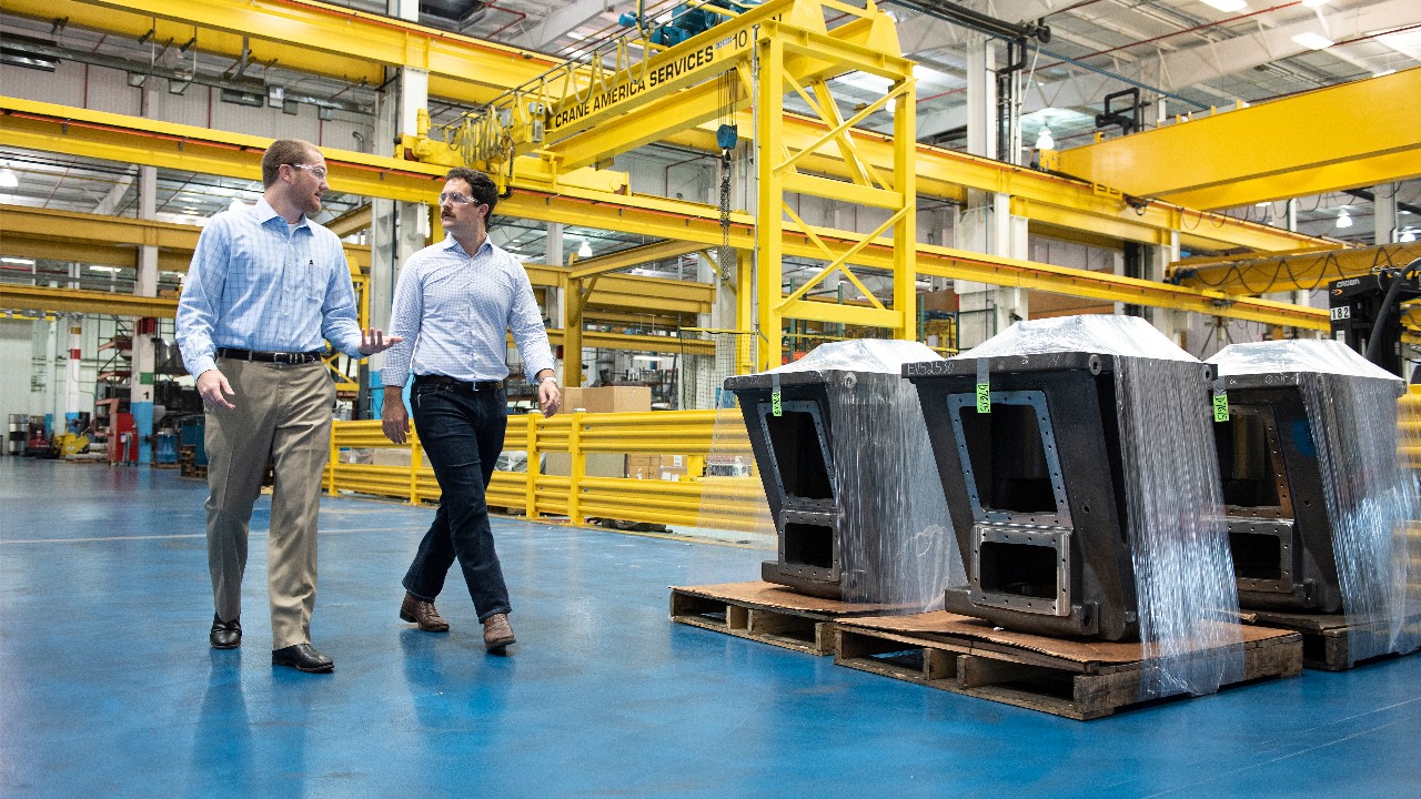 Alex and Hunter Wright walk through the Ariel manufacturing facility 